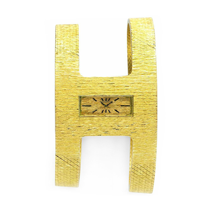 An 18k Gold Textured Gold Wristwatch, by Tiffany & Co., circa 1960