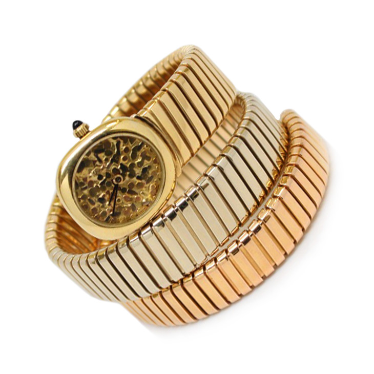 A Tri-colored Gold Tubogas Skeleton Dial Wristwatch, by Bulgari