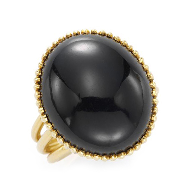 A Star Sapphire and Gold Ring, by Cartier, circa 1960
