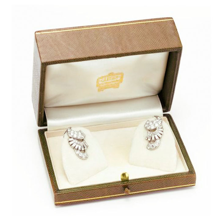 A Pair of Art Deco Diamond and Platinum Scroll Ear Clips, by Cartier, circa 1930