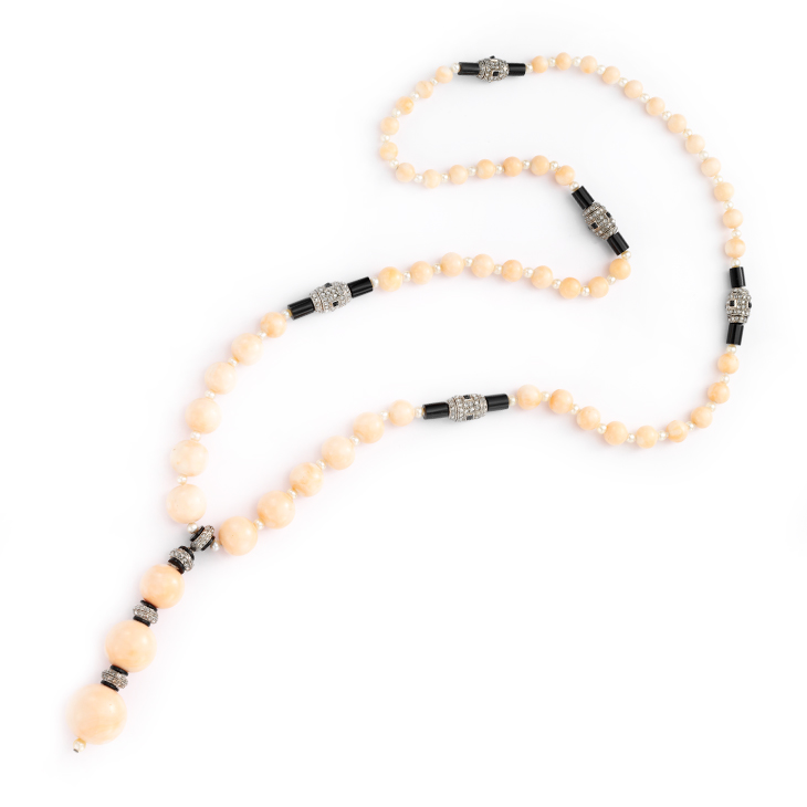 An Art Deco Coral, Onyx and Diamond Sautoir
