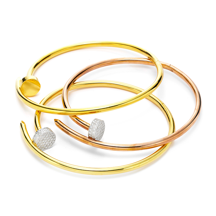 A Group of Gold and Diamond Nail Necklaces, by Aldo Cipullo