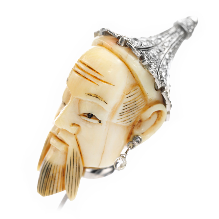 An Antique Carved Ivory, Platinum and Diamond Stick Pin, circa 1900