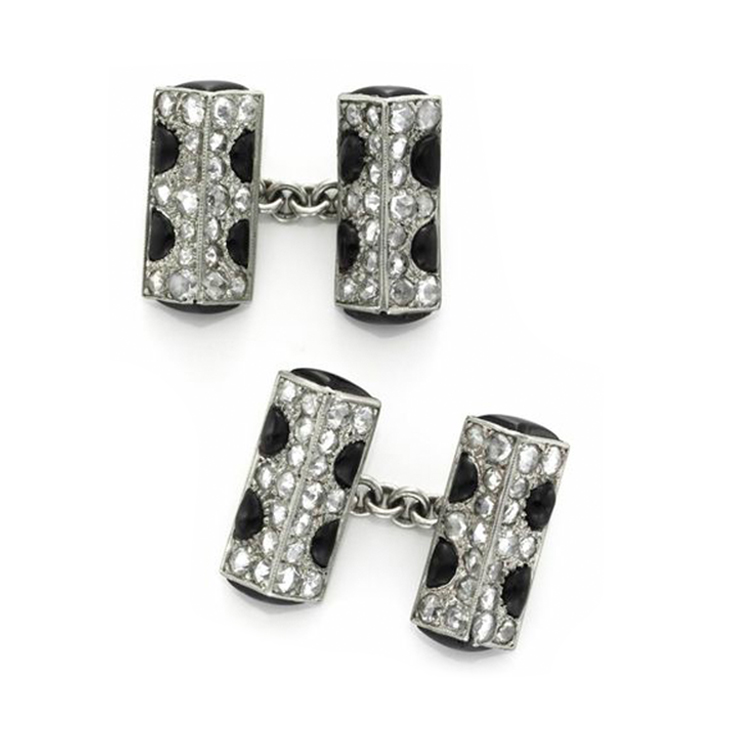 A Pair of Onyx, Diamond and Platinum Cufflinks, by Cartier