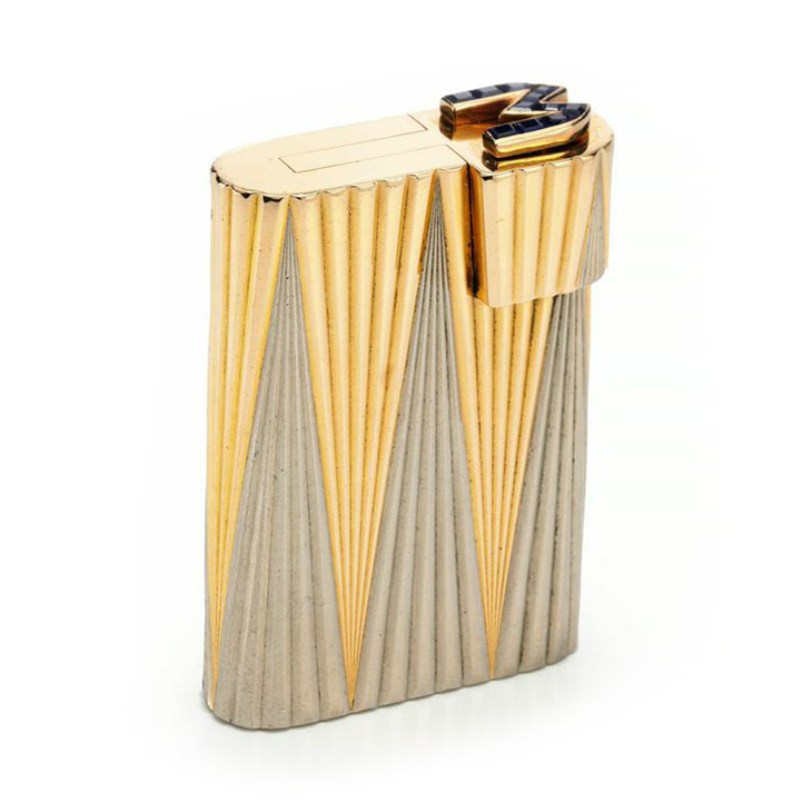 A Bi-colored Gold and Sapphire Lighter, by Cartier
