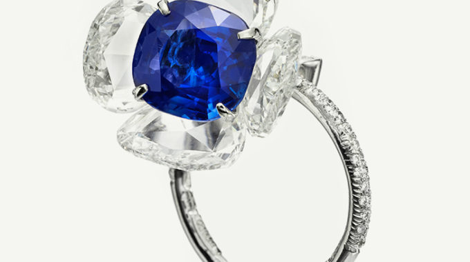Elegant ring with a blue sapphire and diamond petals.