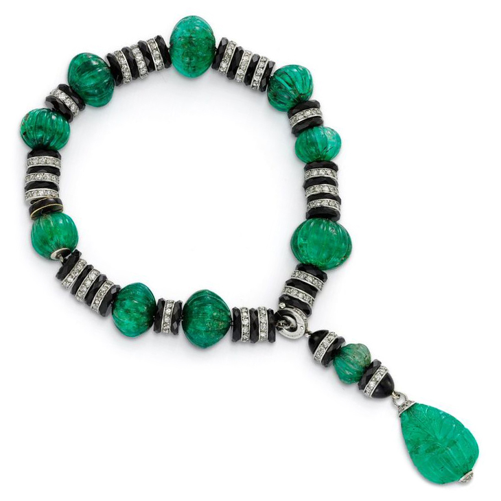 An Art Deco Emerald Bead, Onyx Rondelle and Diamond Tassel Bracelet, circa 1925