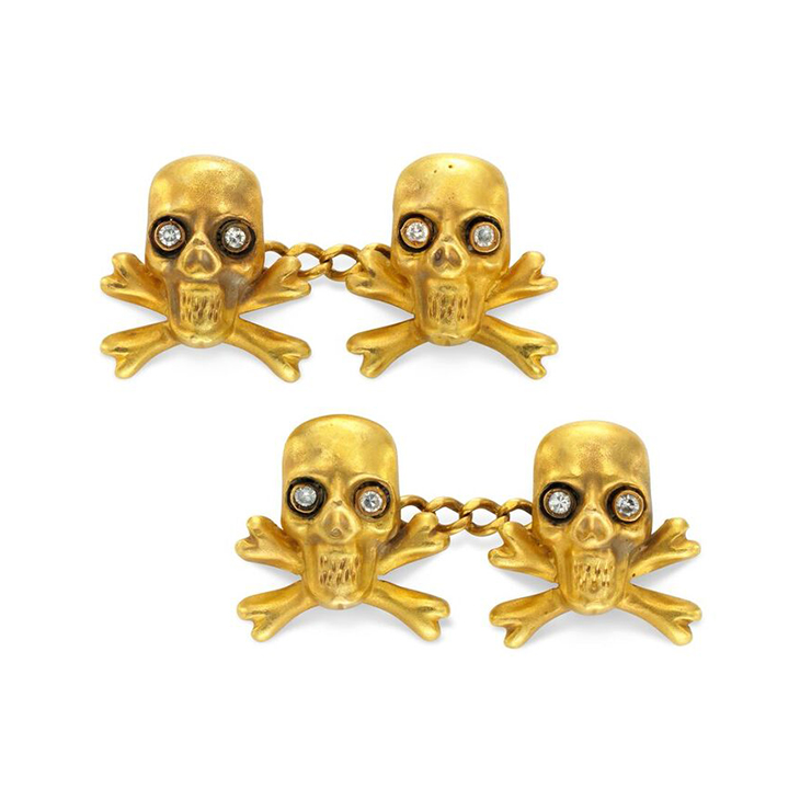 A Pair of Gold and Diamond Skull and Cross bone Cufflinks