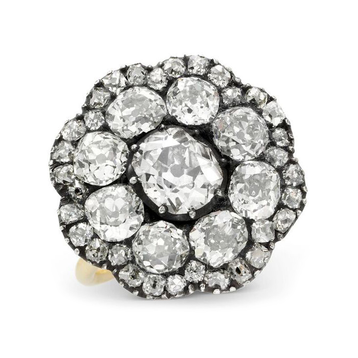 An Old European-cut Diamond Cluster Ring, set in silver and gold