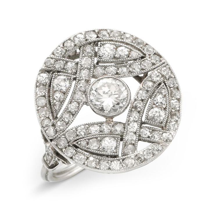 An Edwardian Diamond and Platinum Circular Plaque Ring, circa 1910