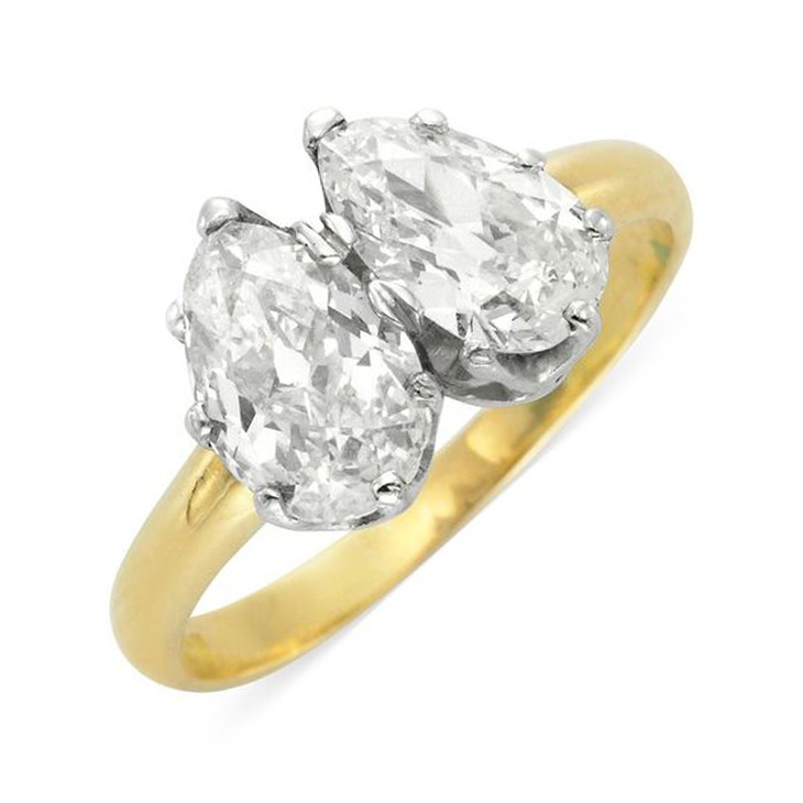 An Antique Twin-stone Pear-shape Diamond Ring, weighing 0.76 and 1.26 carats, late 19th century