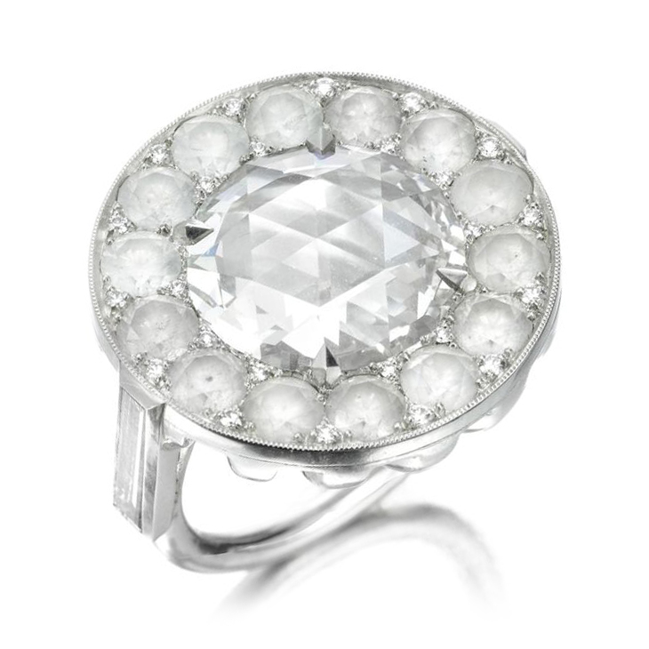 A Rose-cut Diamond, within a circular-cut diamond surround, by SABBA
