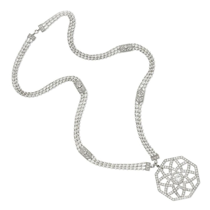 An Edwardian Diamond and Seed Pearl Pendant Necklace, by Cartier, circa 1910