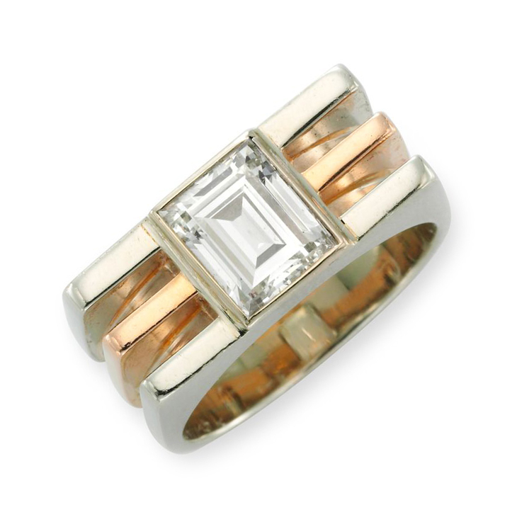 A Diamond and Bi-colored Gold Ring, in the machinist style, centering upon a rectangular-cut diamond