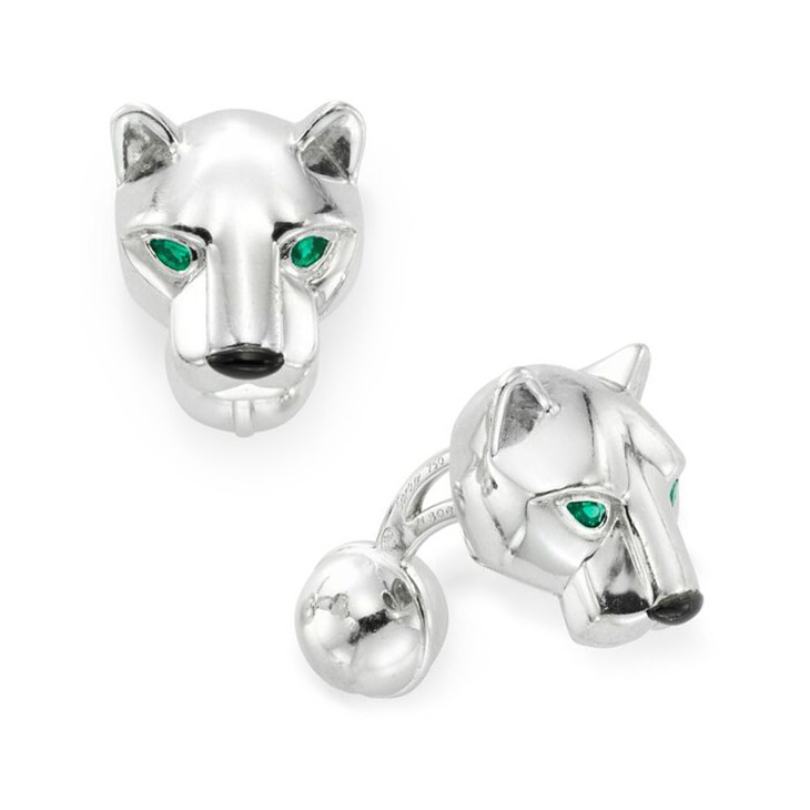 A Pair of Emerald, Onyx and White Gold Panther Cufflinks, by Cartier