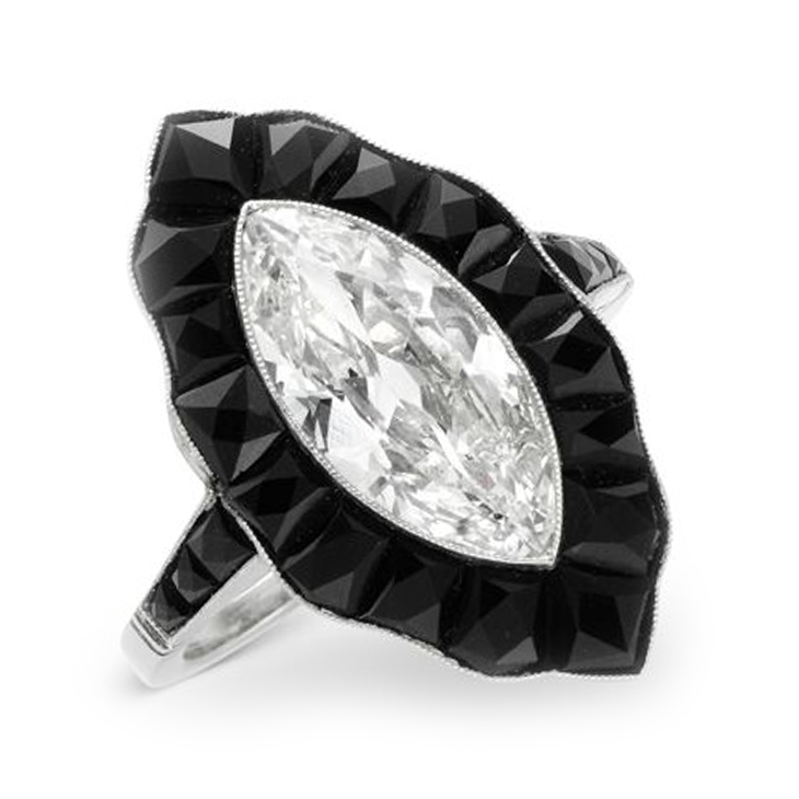 An Art Deco Marquise-cut Diamond and Calibre-cut Onyx Ring, circa 1925