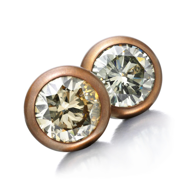 A Pair of Fancy Colored Diamond Stud Earrings, of 10.22 and 10.45 carats, set in copper and gold, by Hemmerle