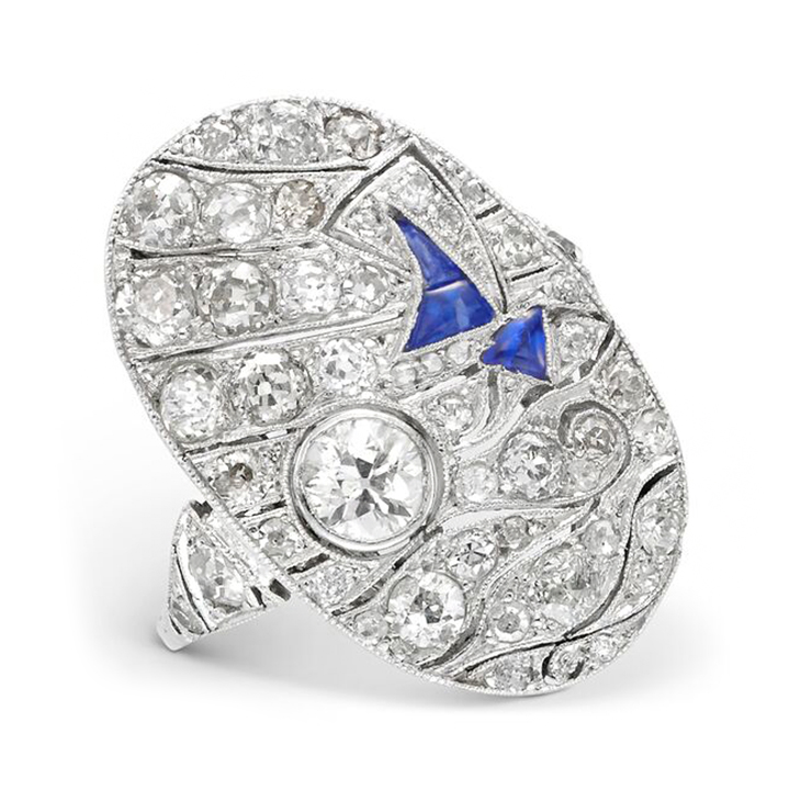 An Art Deco Sapphire and Diamond 'Sailing Scene' Plaque Ring, circa 1930