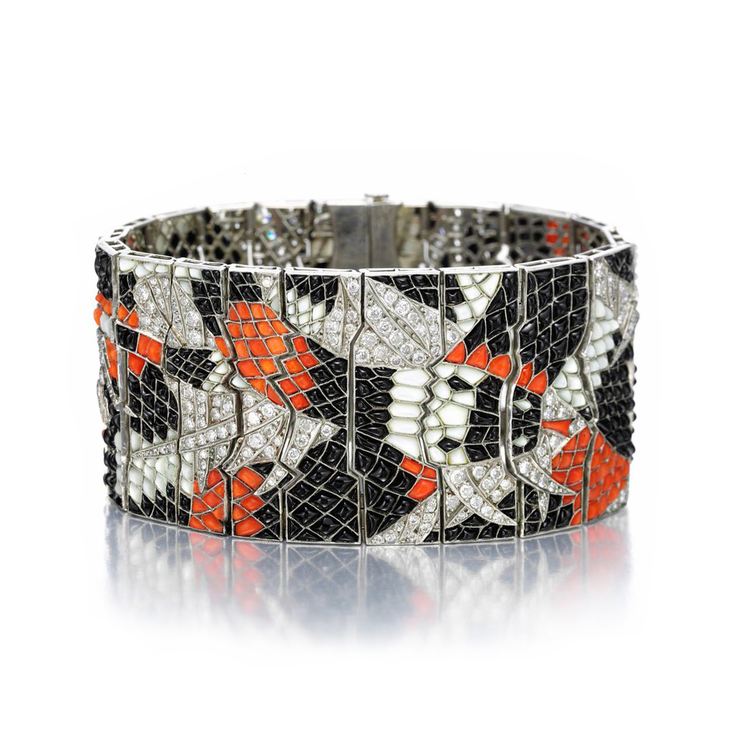 An Art Deco Mother of Pearl, Coral and Onyx 'Snake' Bracelet, circa 1925