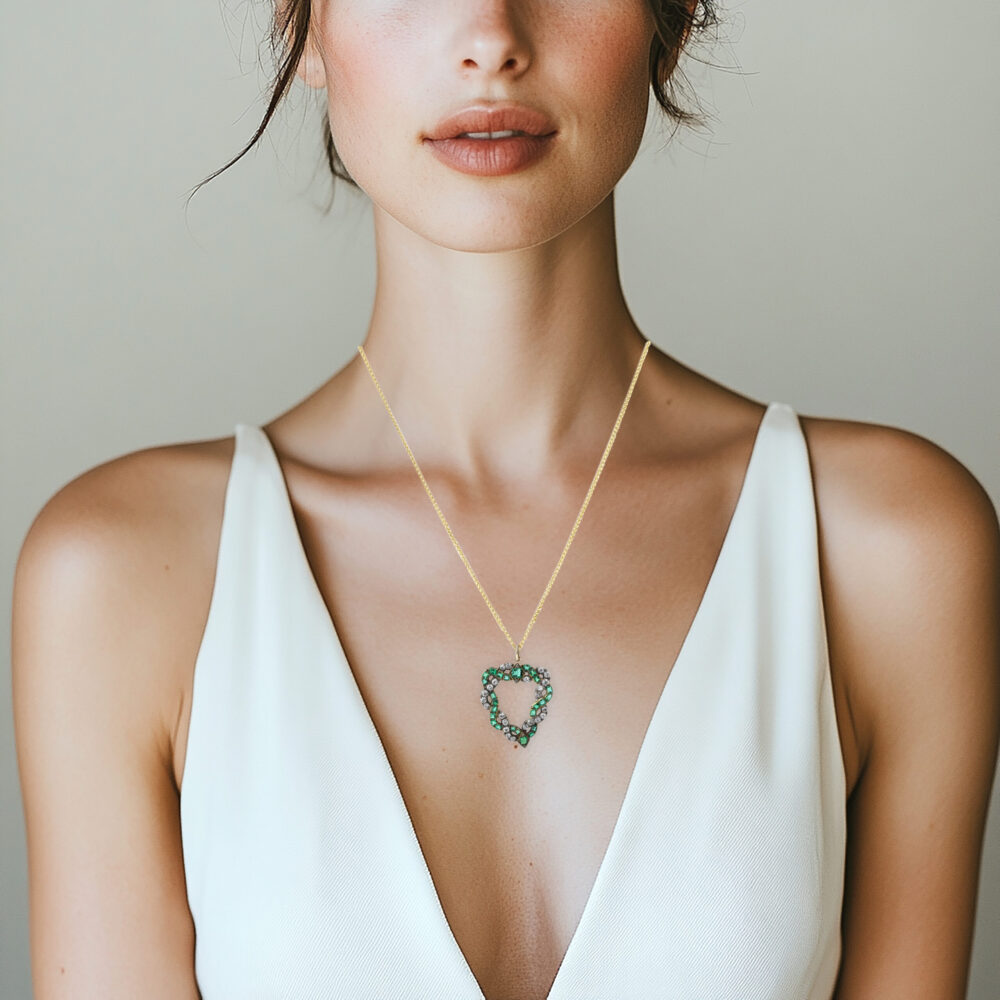 An Emerald and Diamond Heart Pendant