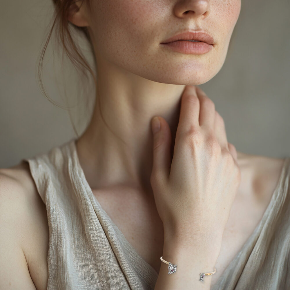 A Silver, Gold and Diamond Bangle Bracelet