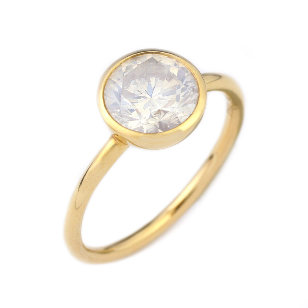 A Round Milky Diamond and Gold Ring
