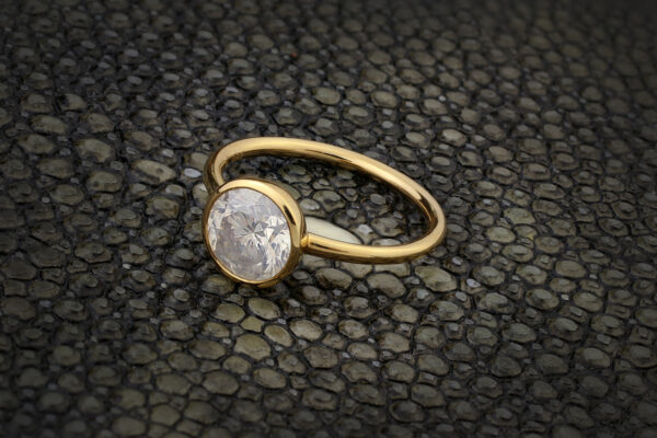 A Round Milky Diamond And Gold Ring