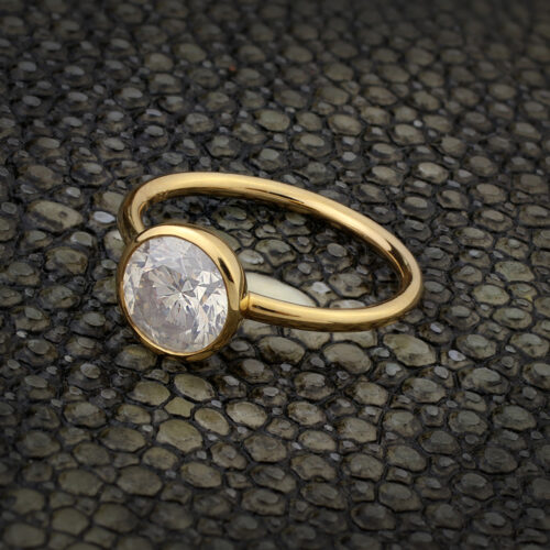 A Round Milky Diamond and Gold Ring