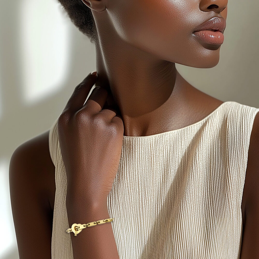 Cartier 'Fidelity' Gold Link Bracelet with Heart Key Pendant
