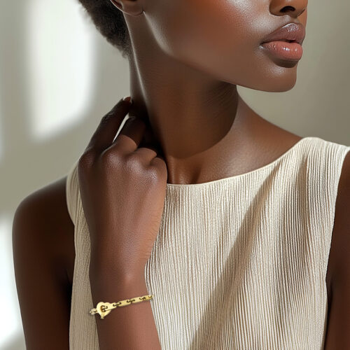 Cartier 'Fidelity' Gold Link Bracelet with Heart Key Pendant