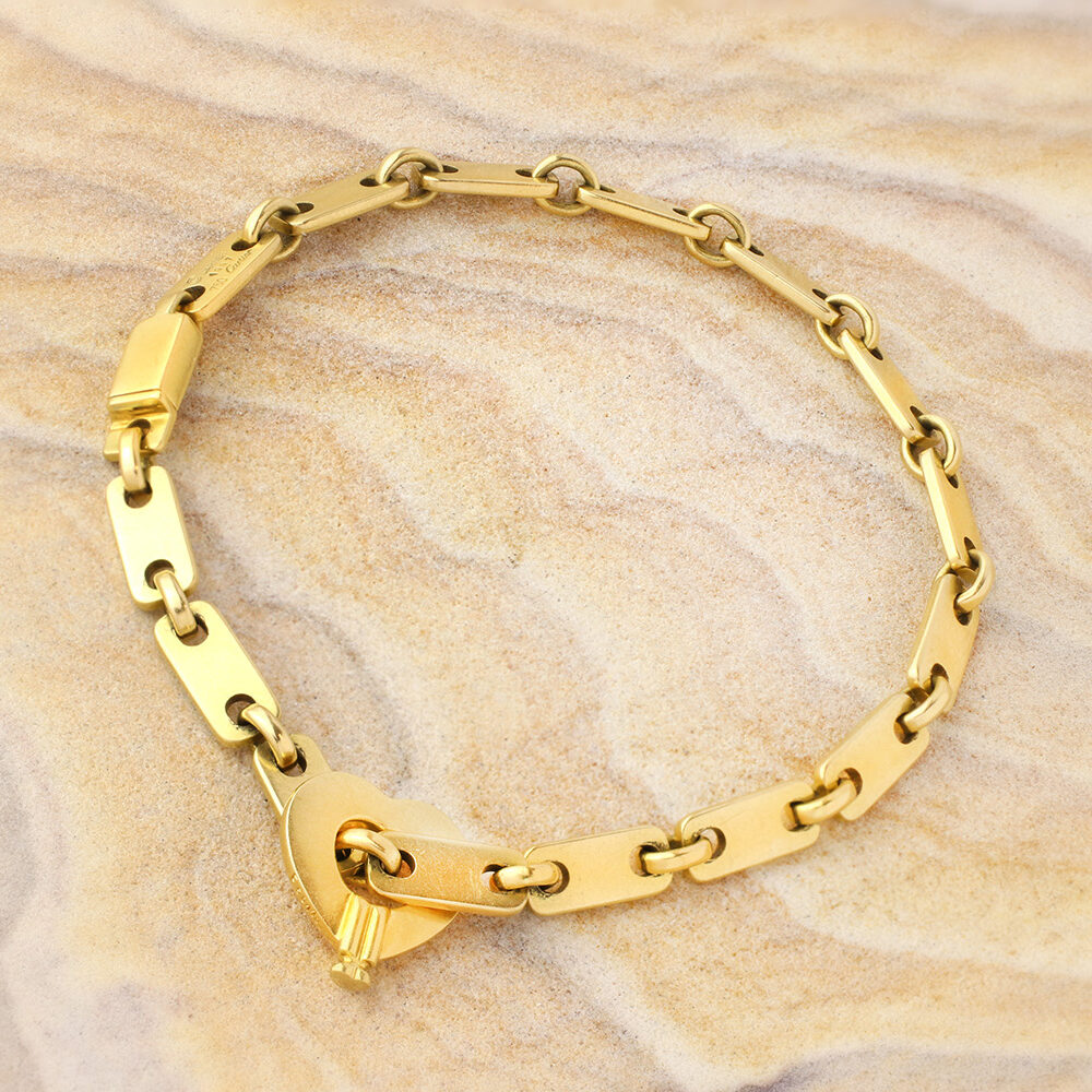 Cartier 'Fidelity' Gold Link Bracelet with Heart Key Pendant