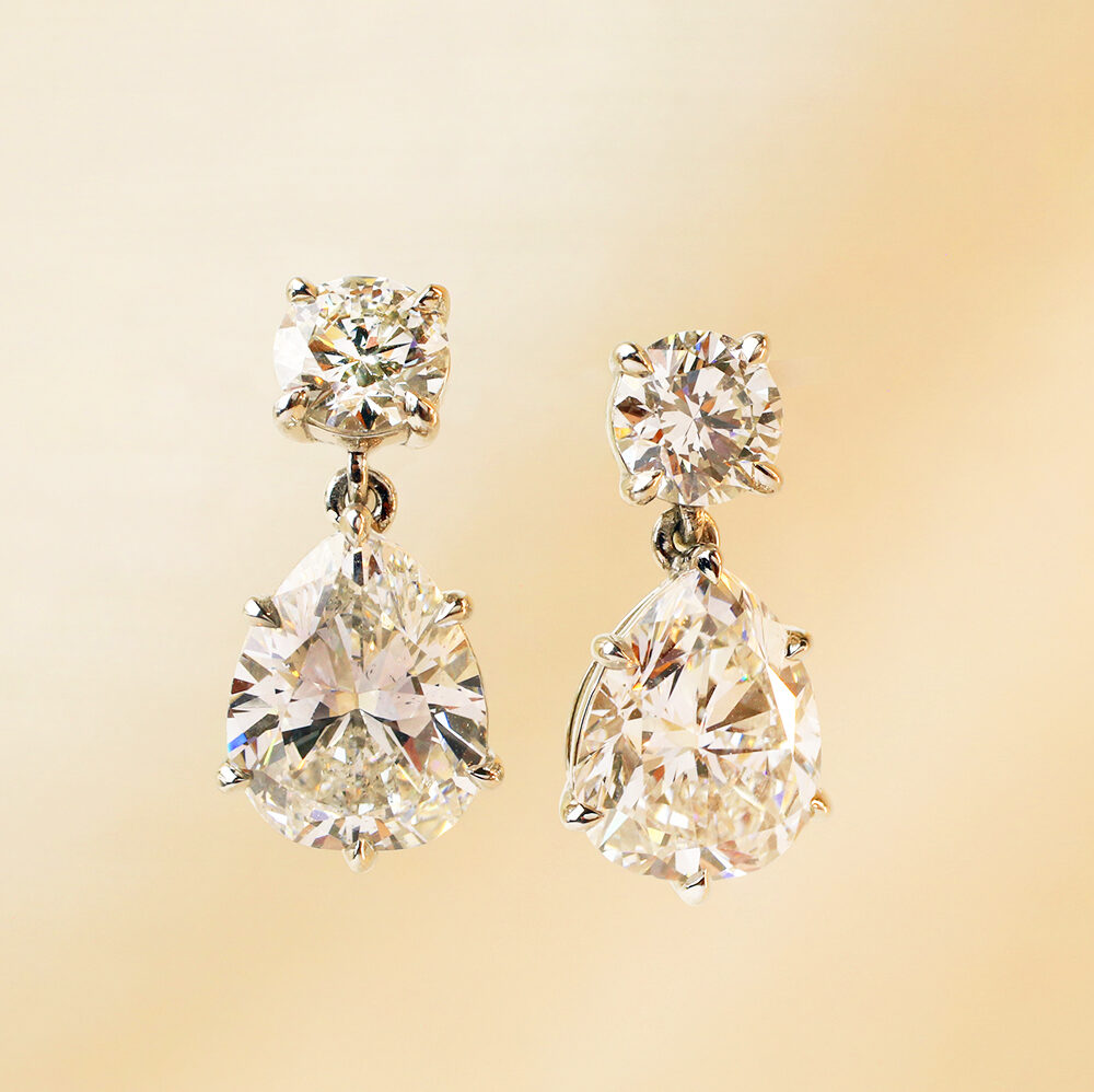 Round and Pear Shaped Diamond Ear Pendants