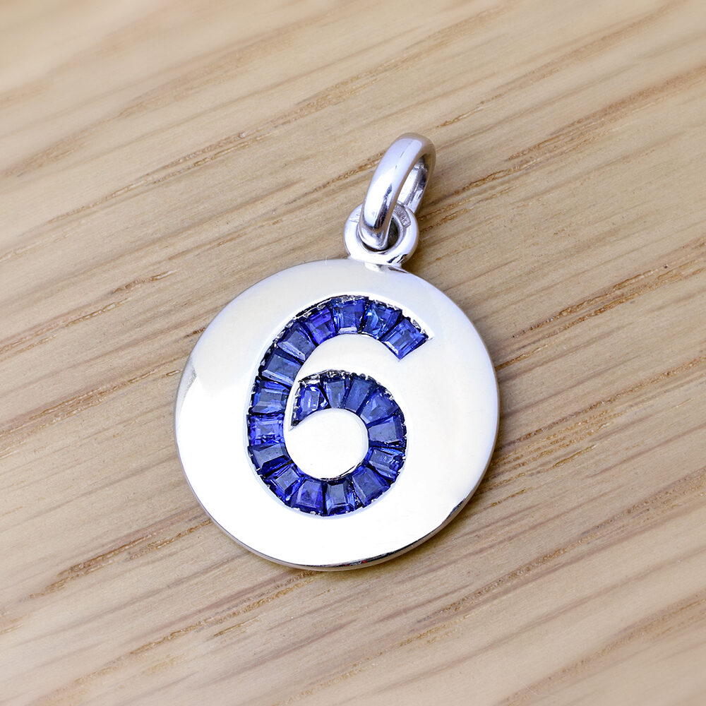 Sapphire and White Gold '6' Charm Pendant